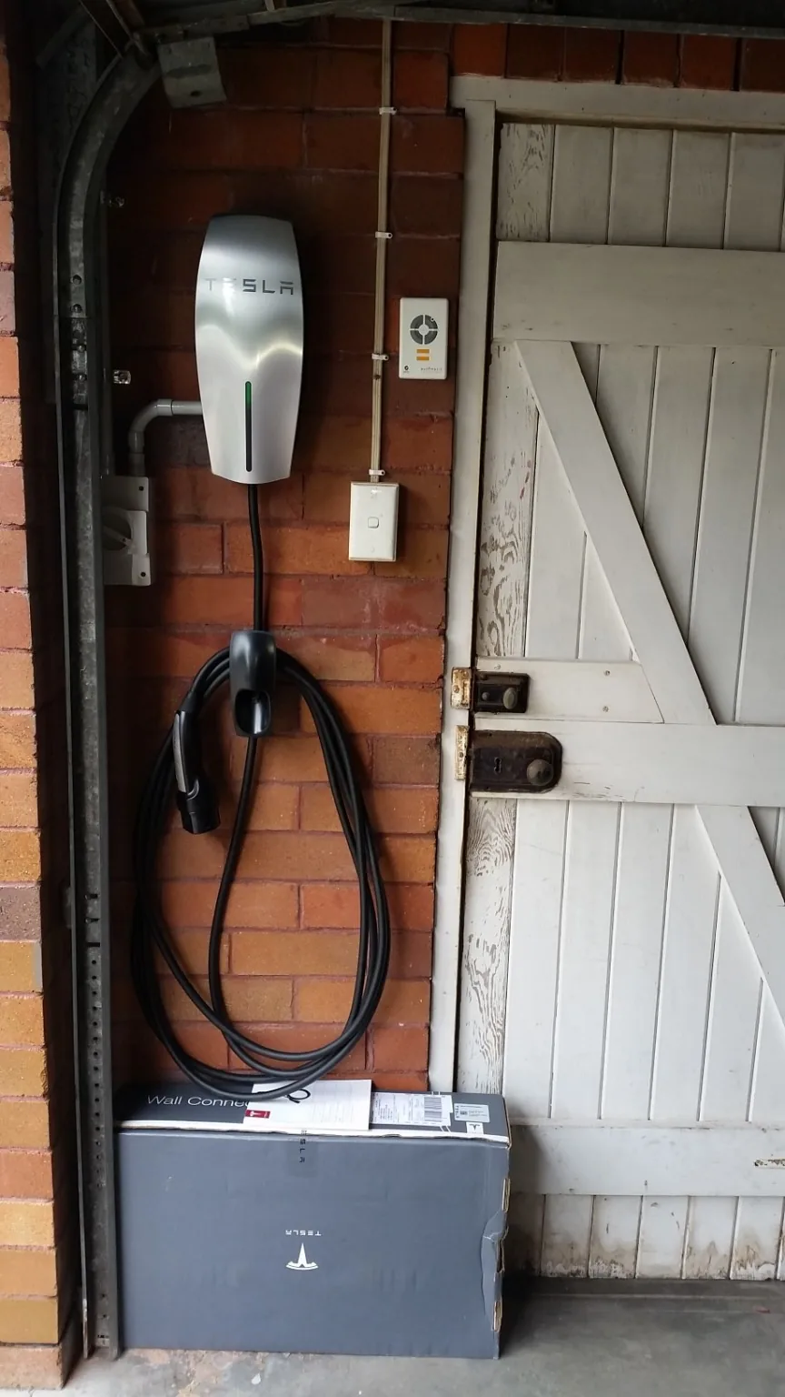 Wall-mounted electric vehicle charger installation