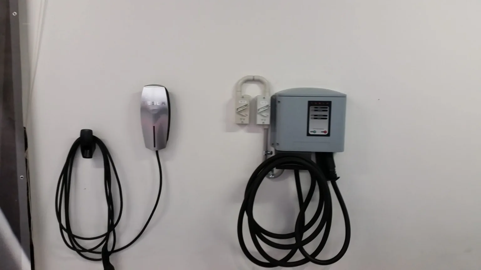 Two Tesla Wall Connector charging points in a garage installation